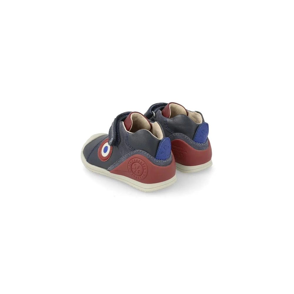 Biomecanics Azul Marino Y Botin Elasticos Casual toddler shoes; navy with red heel and elastic straps, two shoes.