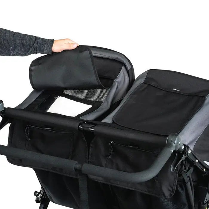 Bob Revolution Flex 3.0 Duallie Stroller in black, dual-seat setup with padded handles being opened.