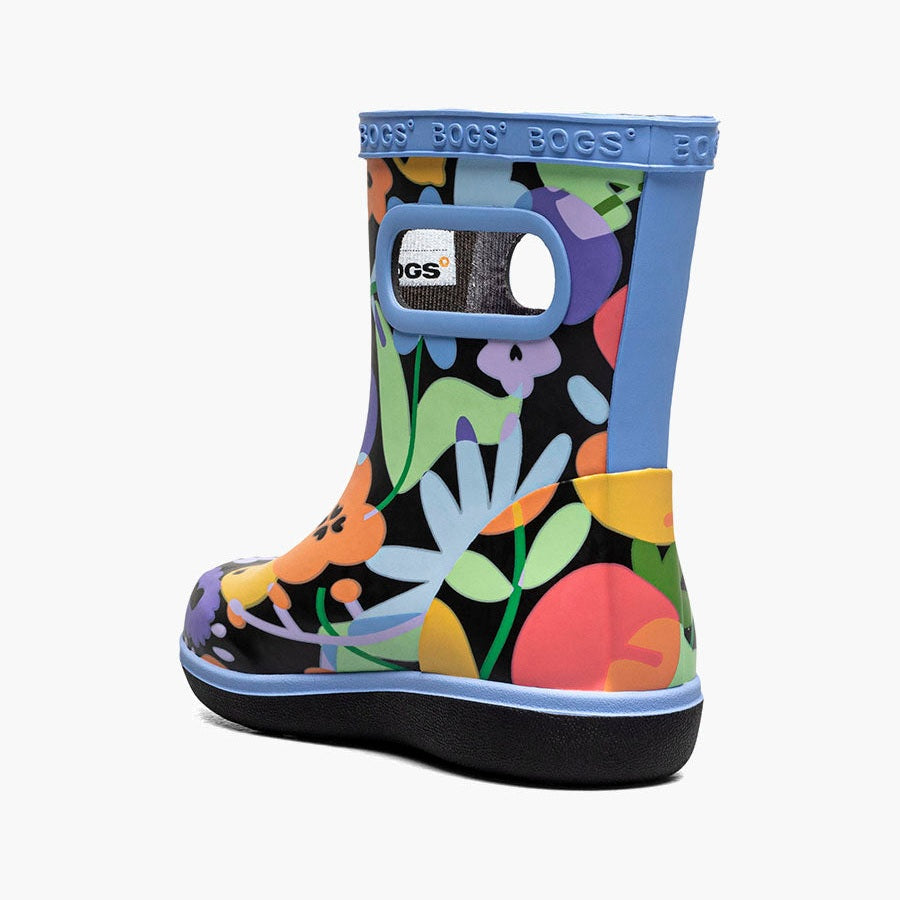 Bogs Skipper II Overlap Flowers Black Multi toddler boots being worn by a toddler, featuring colorful floral print and blue trim.