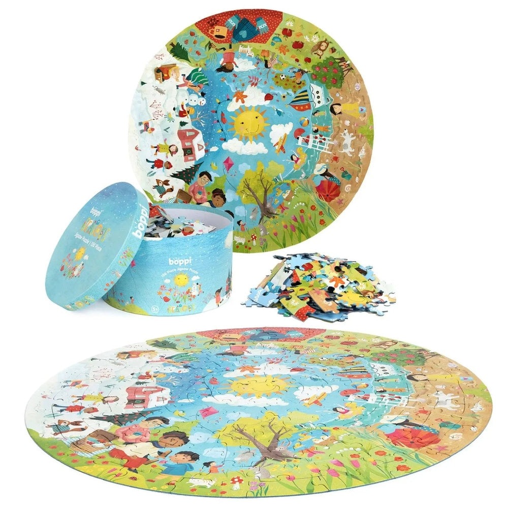 Boppi 150 Piece Kids Round Jigsaw Puzzle - vibrant outdoor scene, scattered pieces, blue box nearby