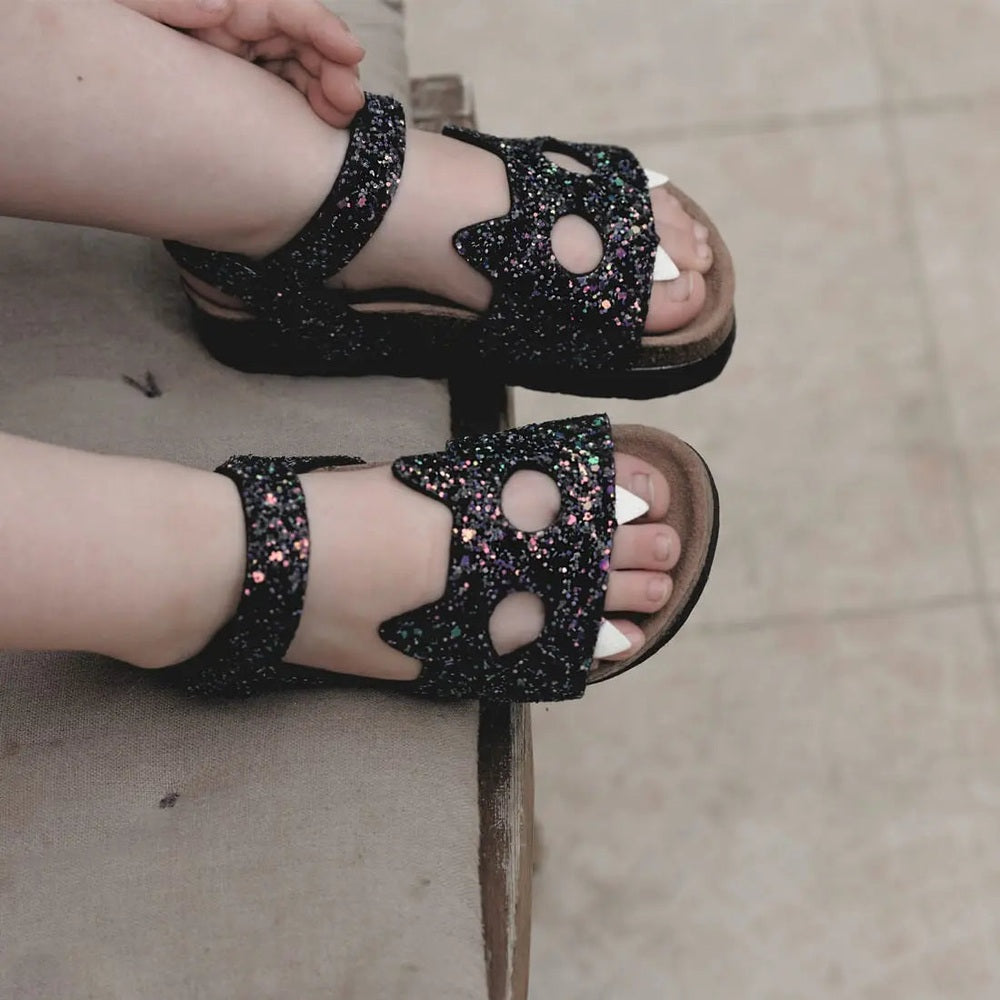 Boxbo Fox Cork Clog Unisex Sandal Black Glitter pair worn on feet, showing cork sole and glittery straps.