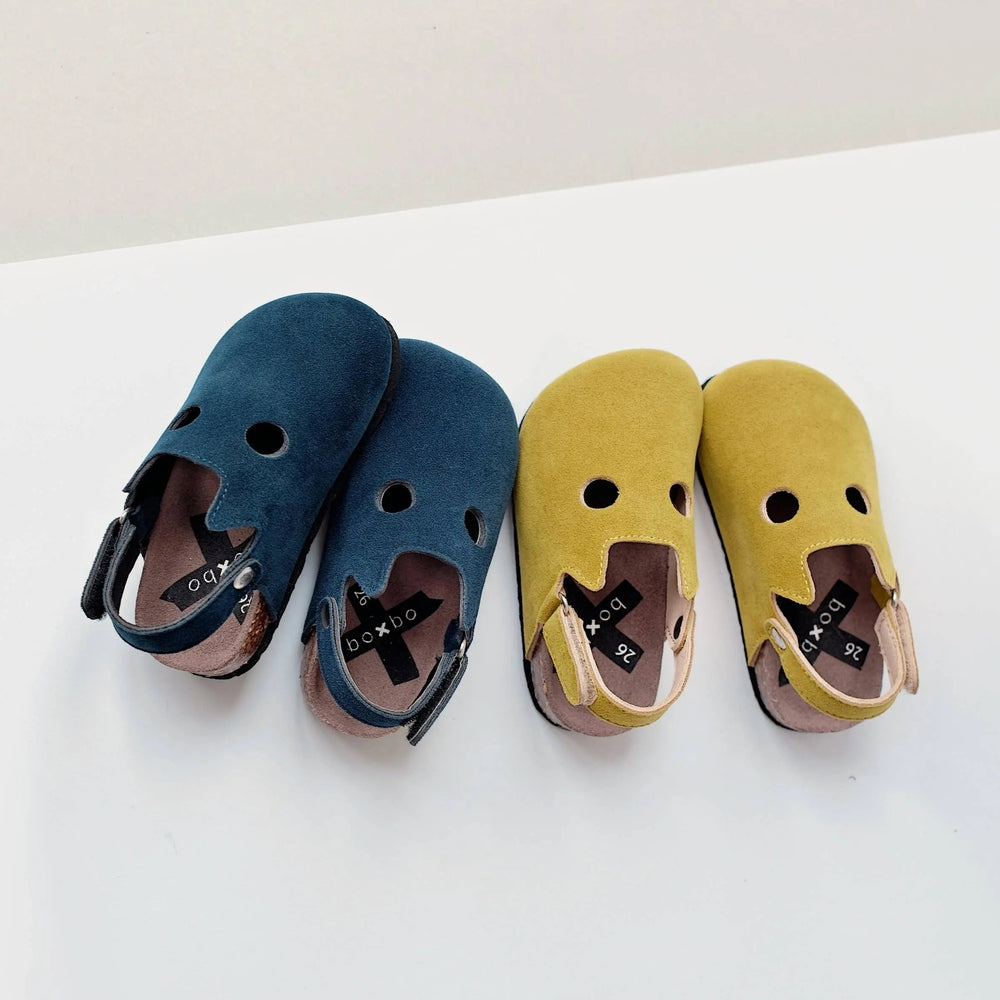 Boxbo Fox Cork Clog Unisex Sandal Blue, two kid sandals in blue and yellow displayed on a white surface