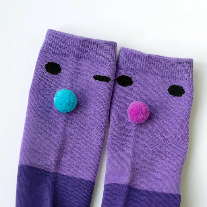 Boxbo Wistiti High Socks Violet, 2-pack, purple with black eye dots and colorful pom-poms on the front.