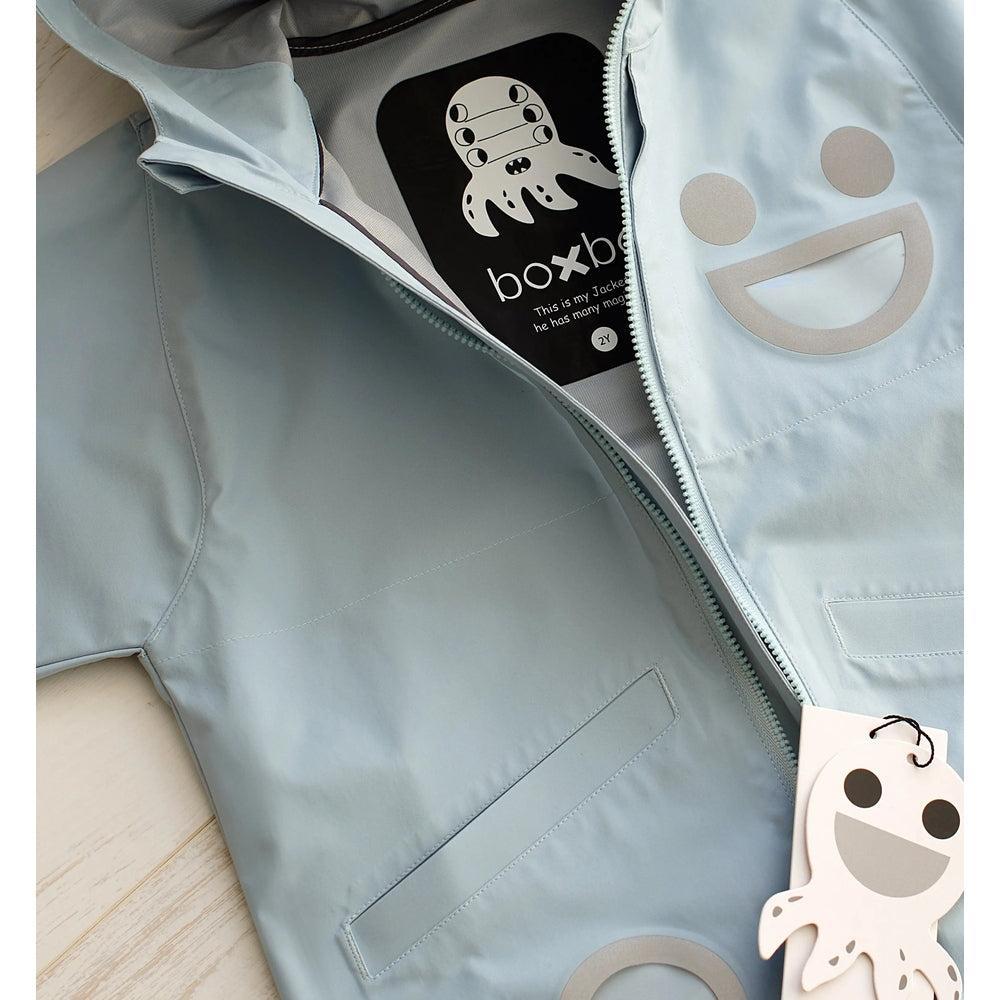 Boxbo Wistiti Windbreaker Rain Jacket Blue with front zipper, lightweight waterproof toddler coat shown partially unzipped.