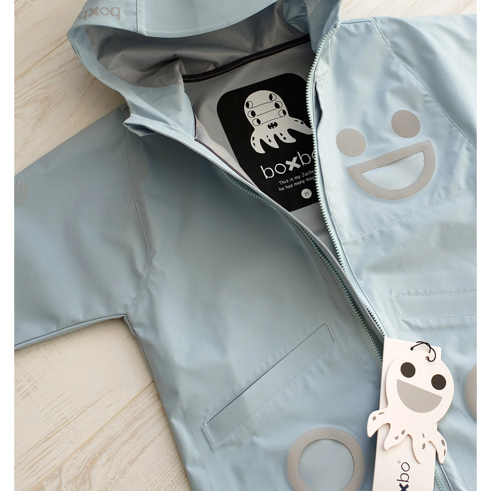 Boxbo Wistiti Windbreaker Rain Jacket in blue being zipped open to reveal interior label and playful octopus logo.