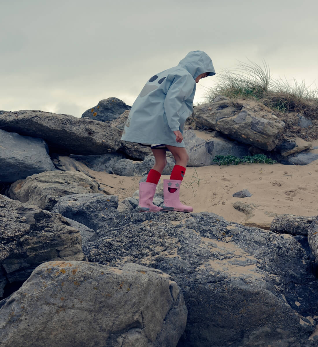 Boxbo Wistiti Blue rain jacket worn by the coast