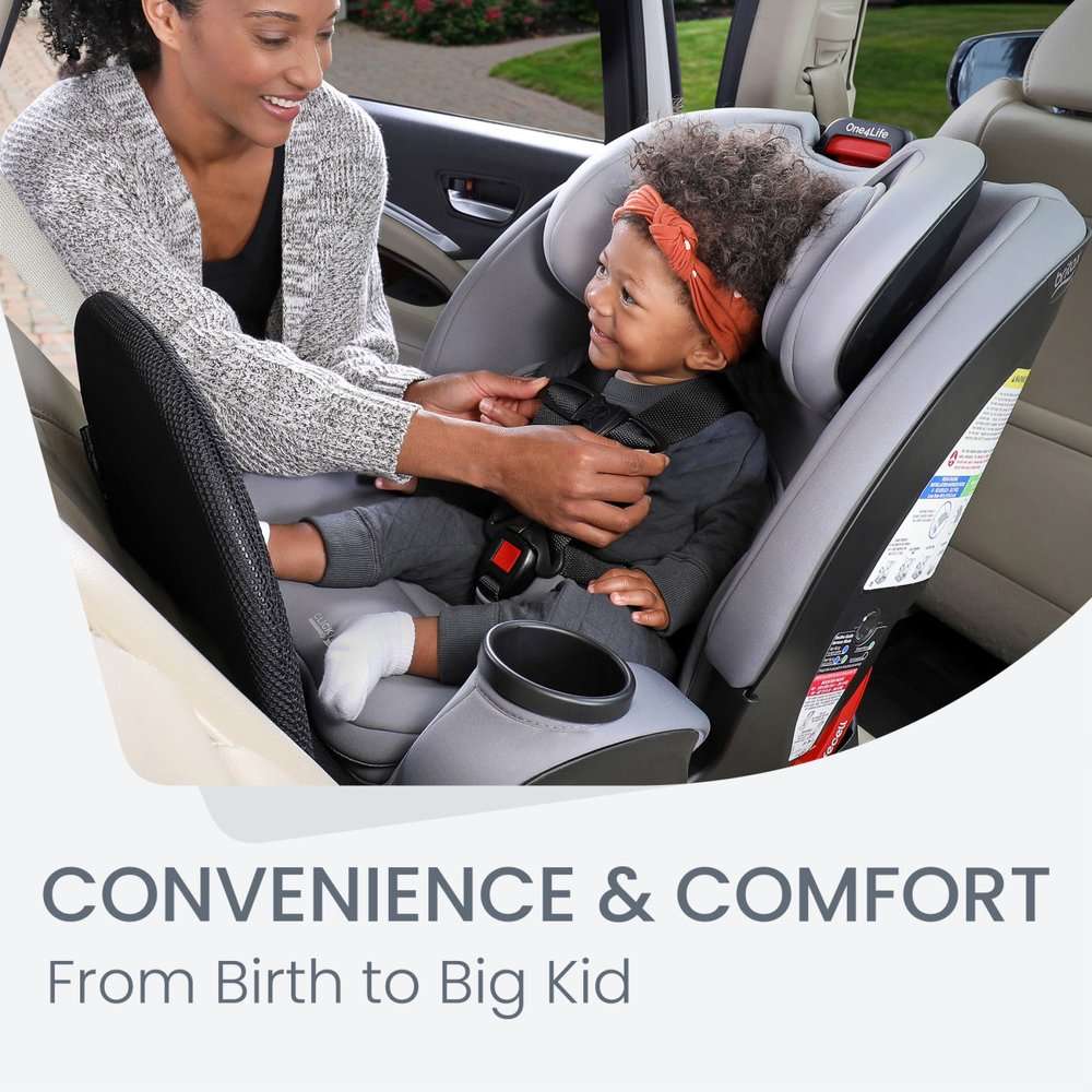 BRITAX One4Life ClickTight all-in-one car seat in gray with child securely buckled beside caregiver