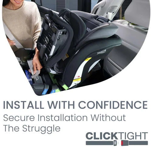 Britax Poplar Convertible Car Seat securely installed in a car by an adult, showing easy-fit seat and harness.