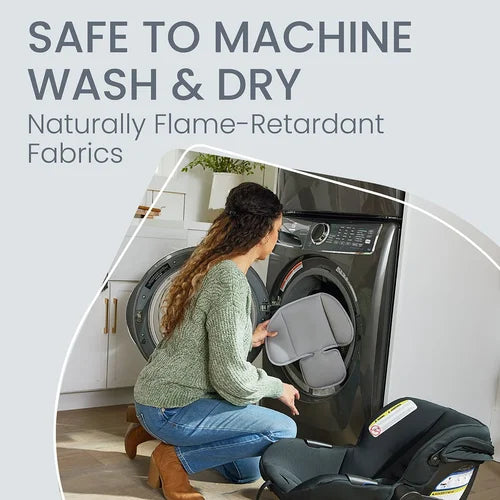Britax Willow Brook Travel System; mother lifts infant car seat beside a ready stroller, showcasing washable, flame-retardant fabrics.