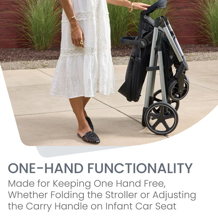 BRITAX Willow Grove SC Travel System; a woman folds the stroller with one hand beside a white-dressed shopper.