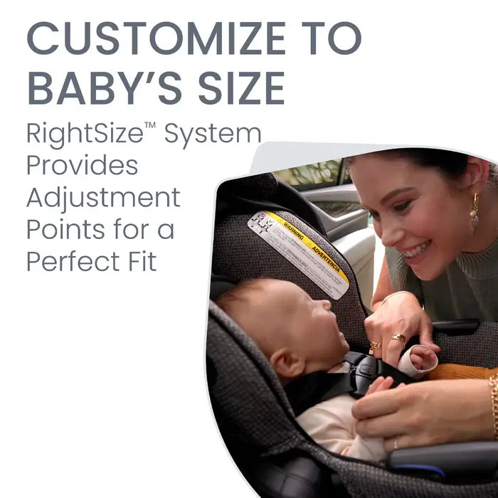Britax Willow SC Car Seat with Alpine Base; smiling mom secures baby in the infant seat.