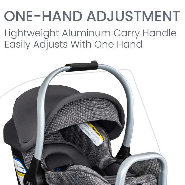 BRITAX Willow SC Car Seat with Alpine Base in gray fabric, showing the lightweight aluminum carry handle being gripped.