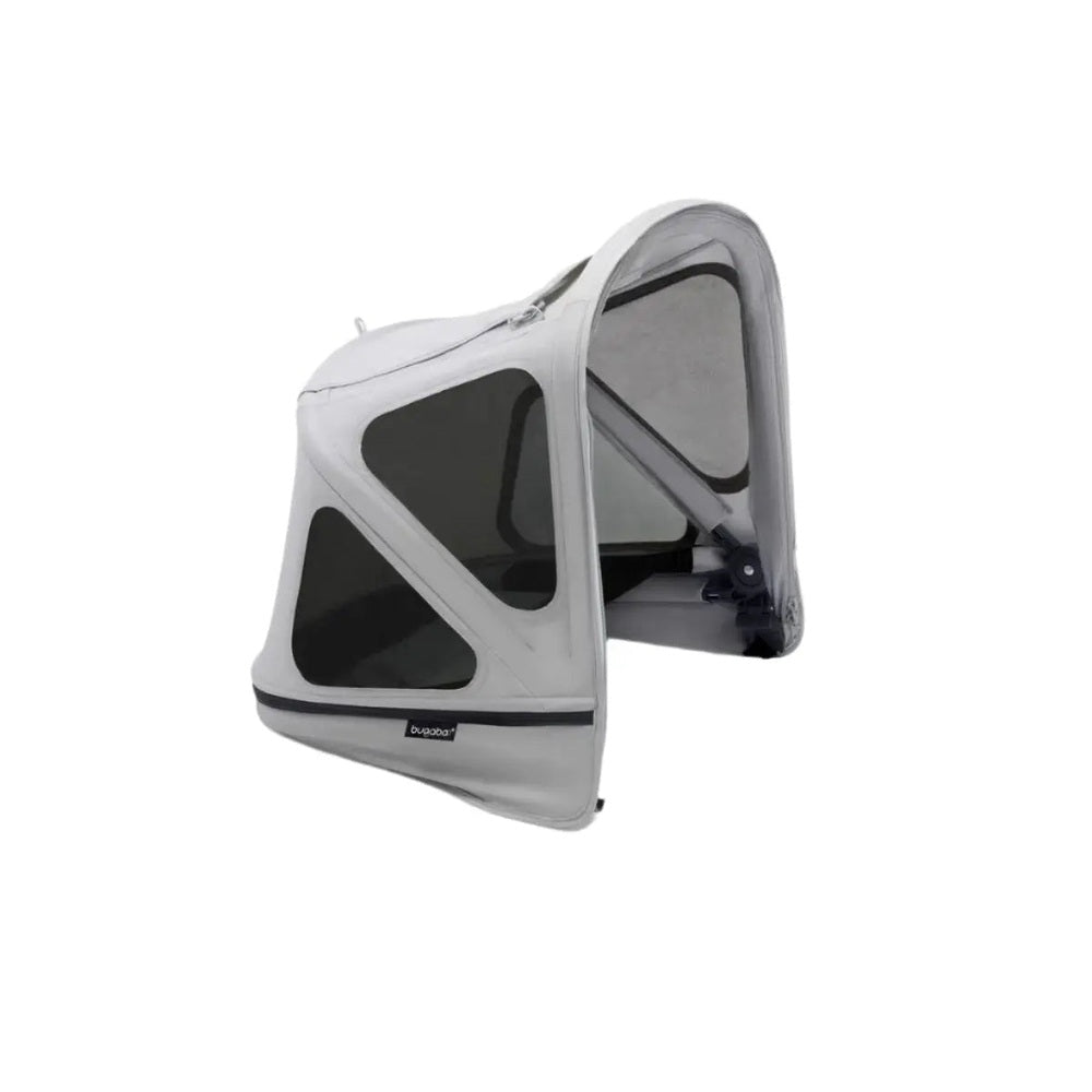 Bugaboo Donkey Breezy Sun Canopy in light gray mounted on a stroller with mesh windows for sun protection.
