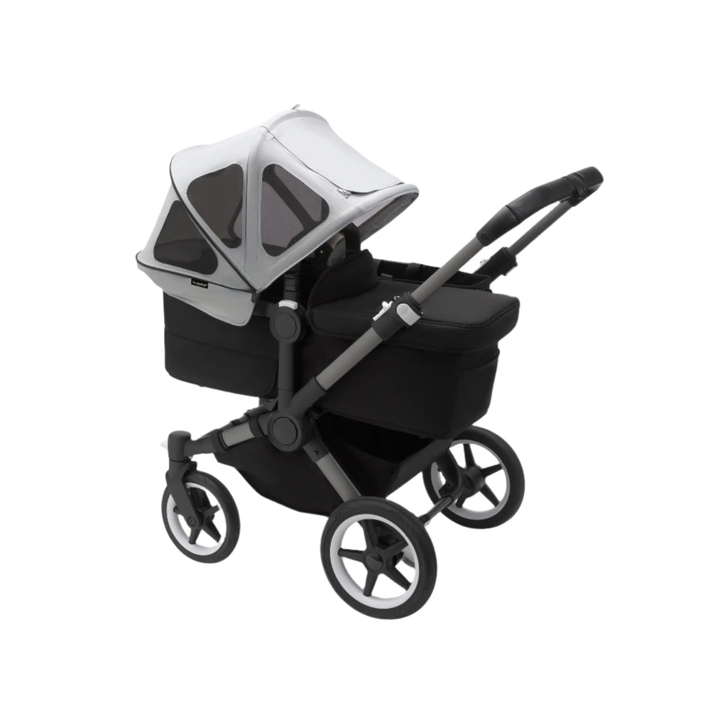 Bugaboo Donkey Breezy Sun Canopy on a black stroller, light gray panels with mesh windows providing shade.