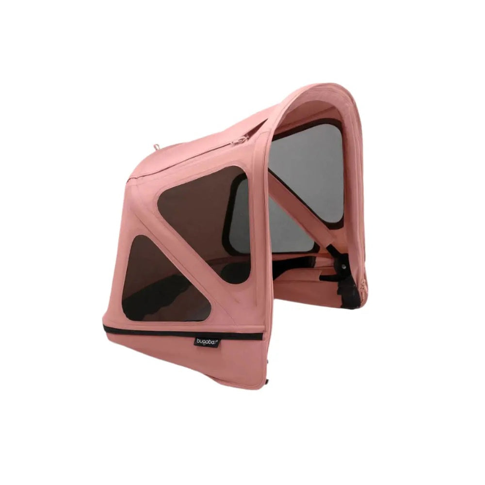 Bugaboo Donkey Breezy Sun Canopy pink with dark mesh panels, shown attached to a stroller for breathable sun protection.