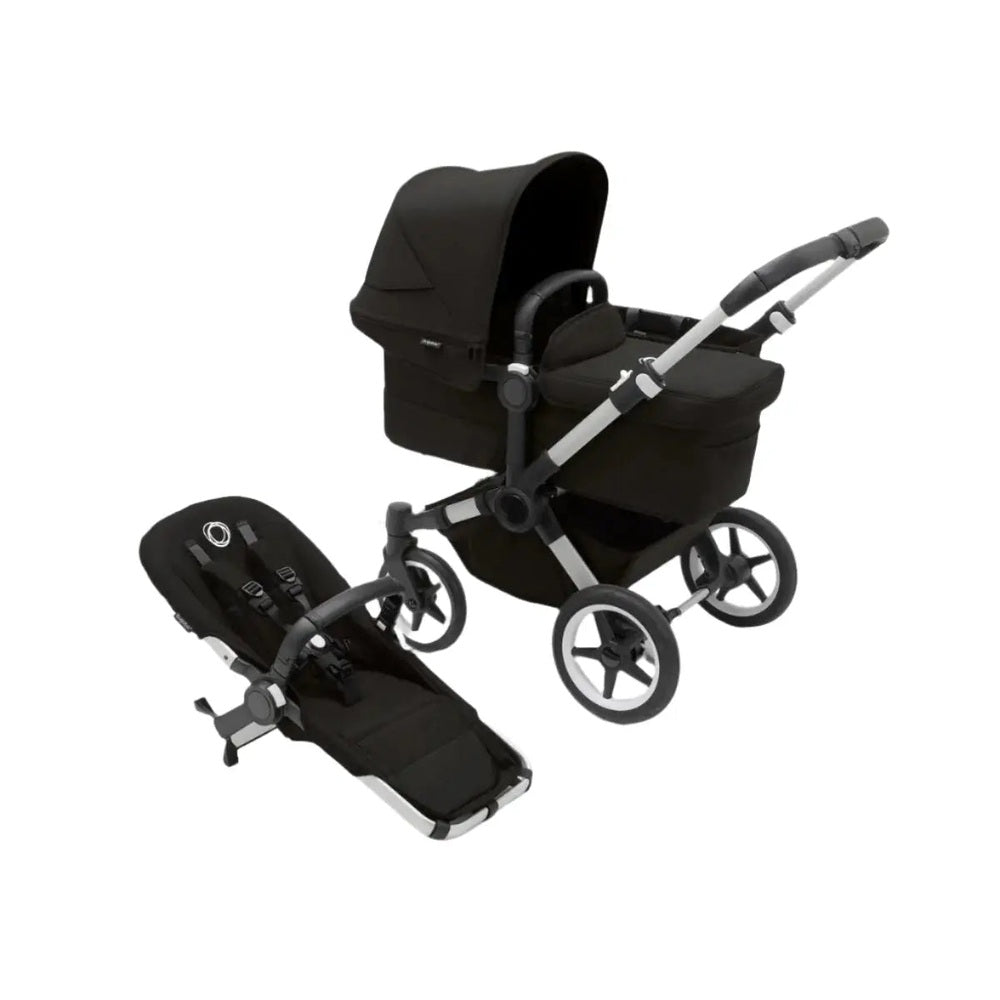 Bugaboo Donkey5 Mono Stroller Complete in black with bassinet attached and a riding board.