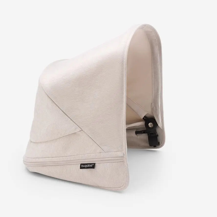 Bugaboo Donkey5 sun canopy in beige fabric, attached to stroller with adjustable shade and hardware.