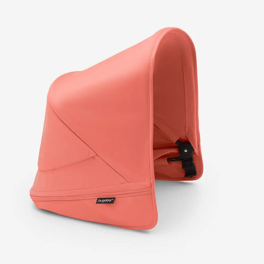 Bugaboo Donkey5 Sun Canopy in coral pink, attached over the stroller seat.
