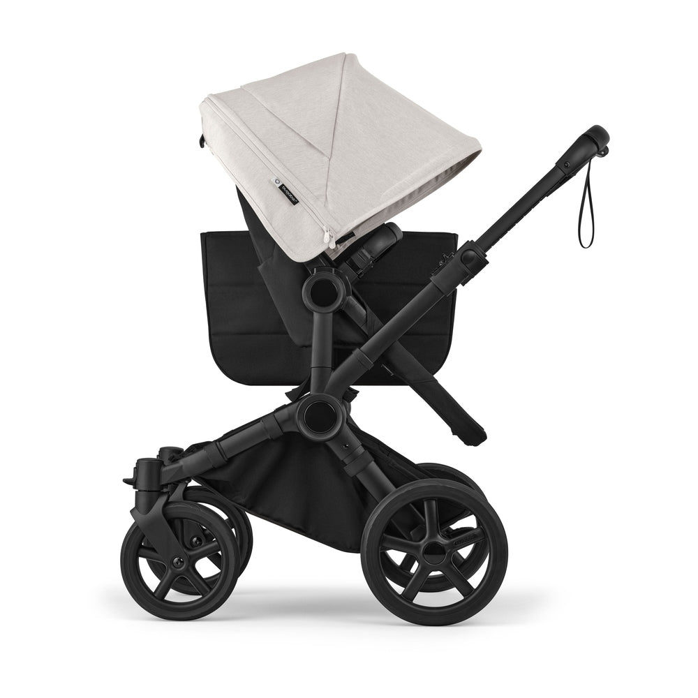 Bugaboo Donkey6 Mono Stroller in Beige canopy with black frame and wheels, side view.