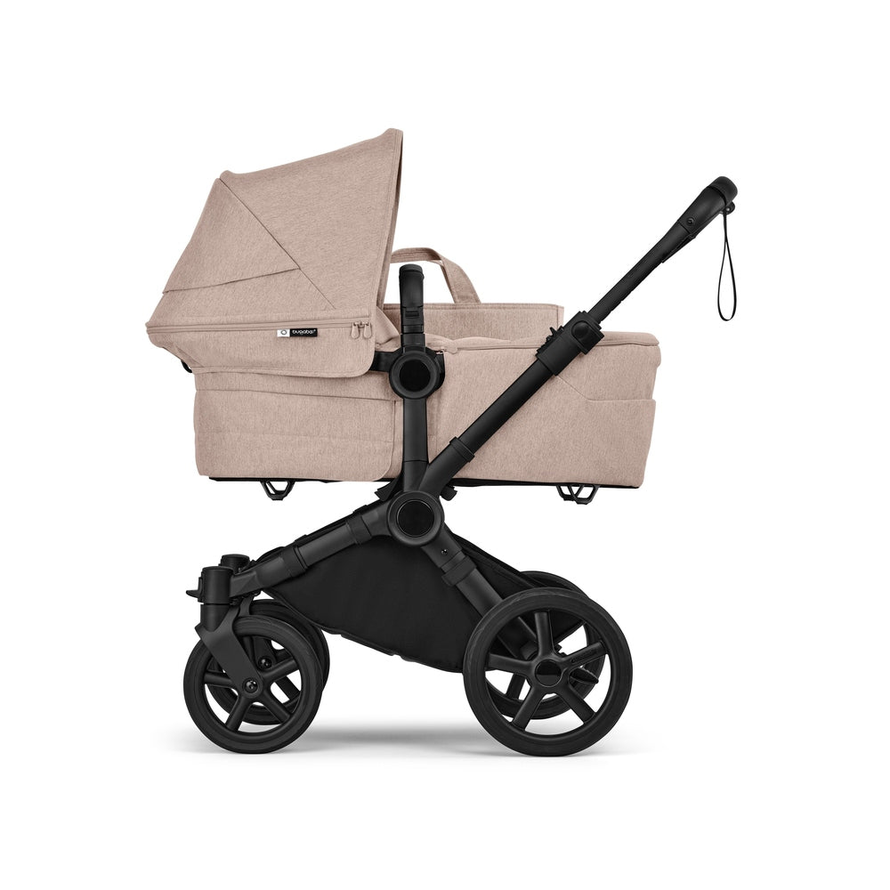 Bugaboo Donkey 6 Mono Stroller in Beige with Bassinet on black chassis side view.