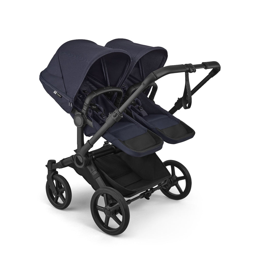 Bugaboo Donkey 6 Mono Stroller in Deep Indigo with twin seats and canopies, front-left view.