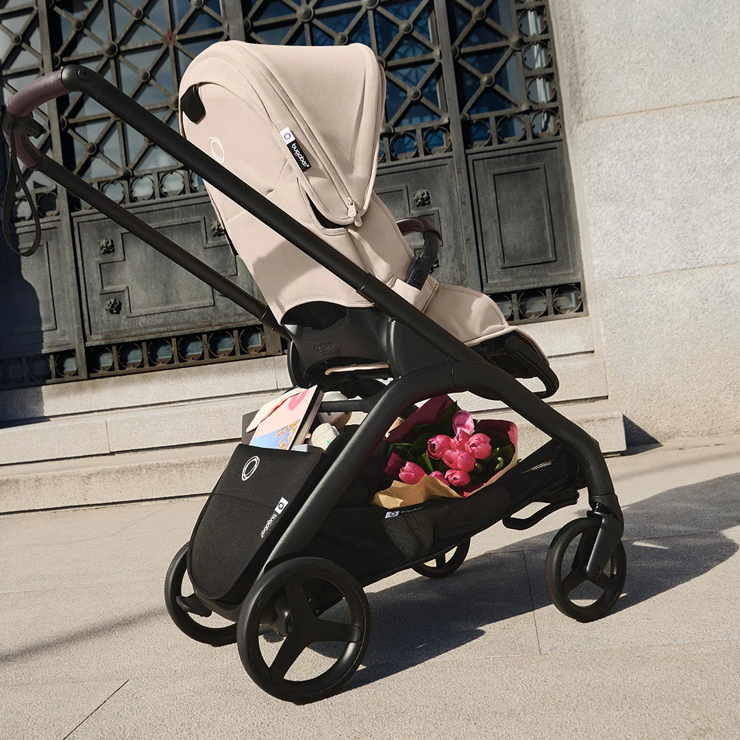 Bugaboo Dragonfly Plus Desert Taupe — seat stroller with underseat basket on a city walk
