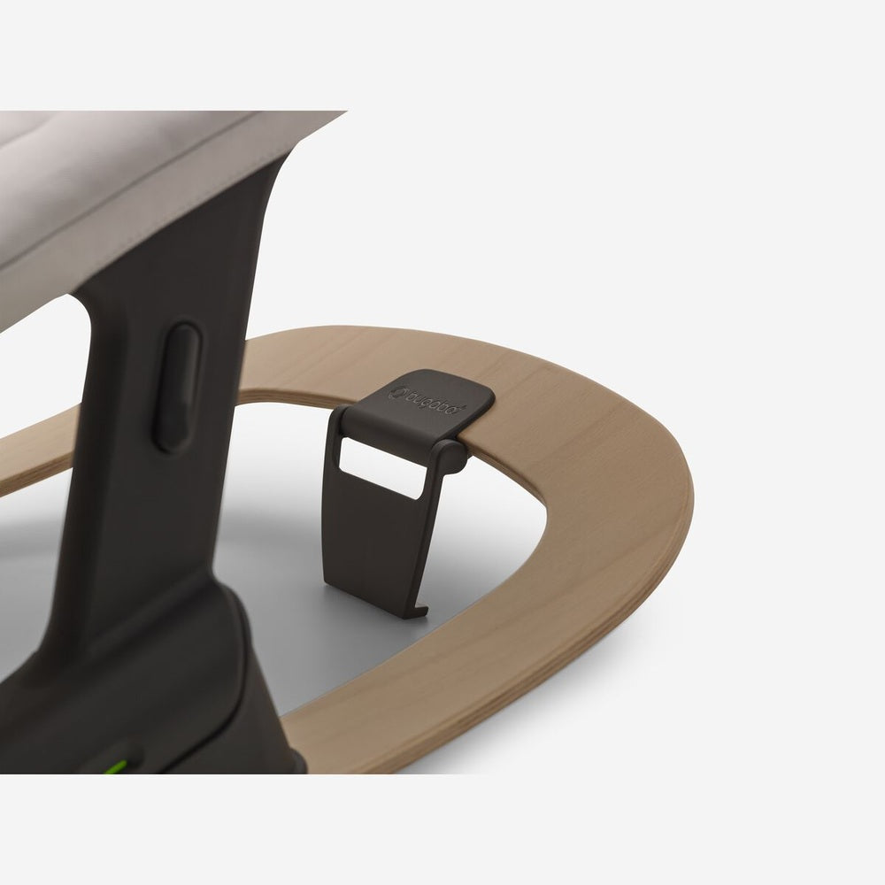 Bugaboo Giraffe rocker frame in neutral wood with dark gray bracket and clamp
