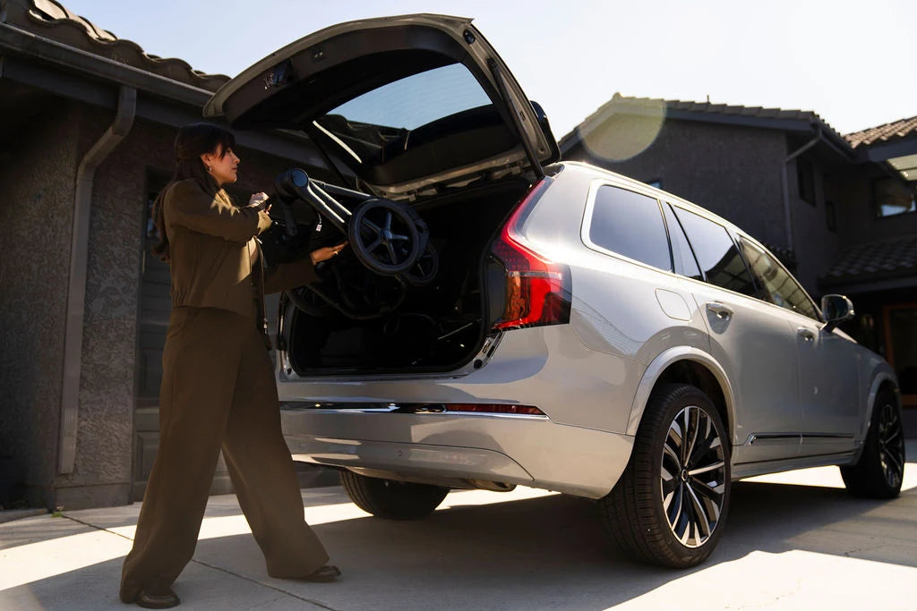 Bugaboo Kangaroo Seat Complete Stroller — folded stroller being loaded into a car trunk