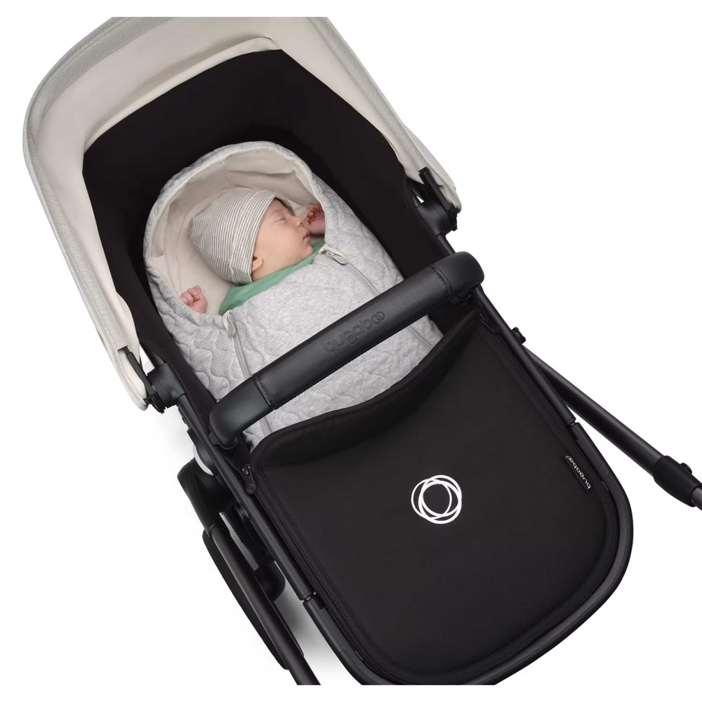 Bugaboo Newborn Inlay in Light Grey Melange with baby in stroller seat.