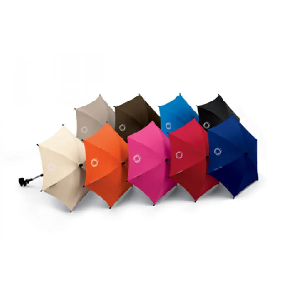 Bugaboo Parasol+ ten-pack of colorful umbrellas arranged in a bright row from beige to blue.