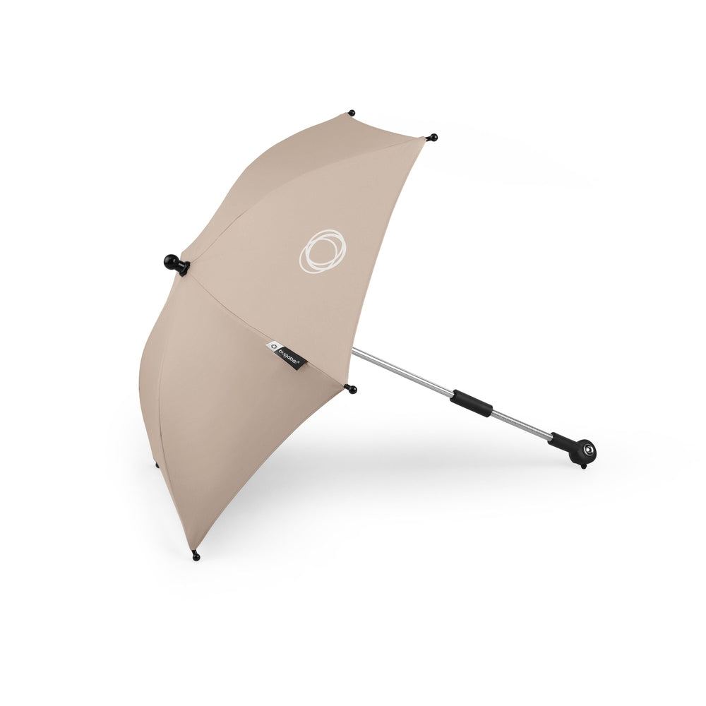 Beige umbrella with black handle and shaft on a white background