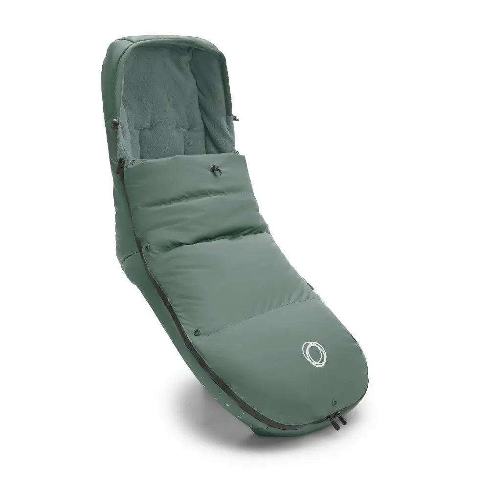 BUGABOO Performance Winter Footmuff in green, thick insulated padding with zipper, shown ready to attach to a stroller.