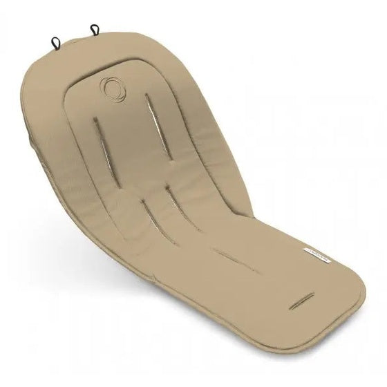 BUGABOO Seat Liner beige installed in stroller seat, with clip tabs visible at top.