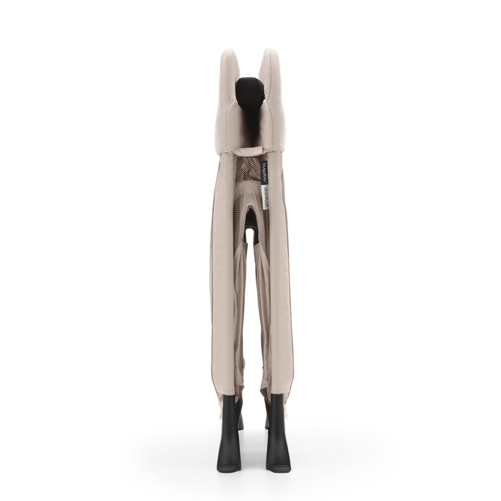 Bugaboo Stardust desert taupe play yard folded side view