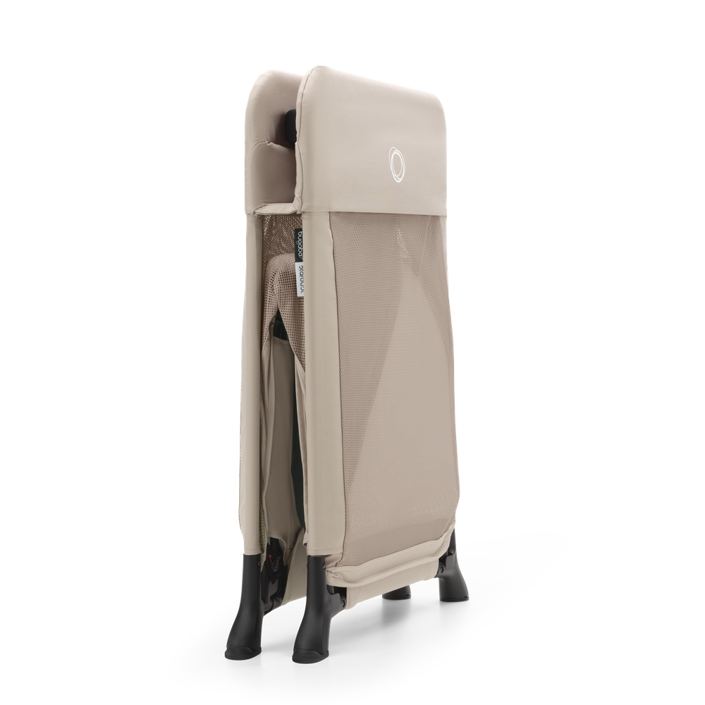 Bugaboo Stardust desert taupe play yard folded three-quarter view