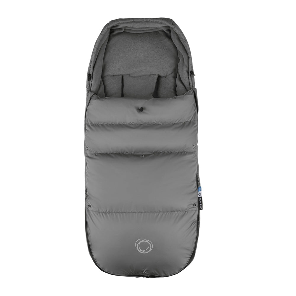 Bugaboo THERMOLITE Performance Footmuff in gray, snugly attached to a stroller to keep baby warm on winter walks.