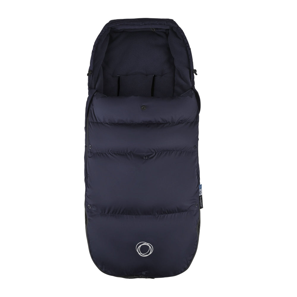 Bugaboo THERMOLITE Performance Footmuff, navy quilted stroller insert keeping baby warm with snug top opening.
