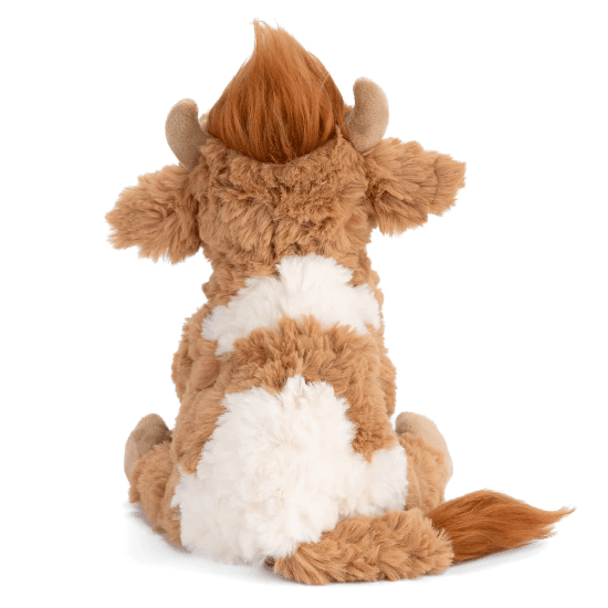 Bukowski Bears Madison the Highland Cow stuffed animal, brown plush with white belly, horns and fluffy tail visible.