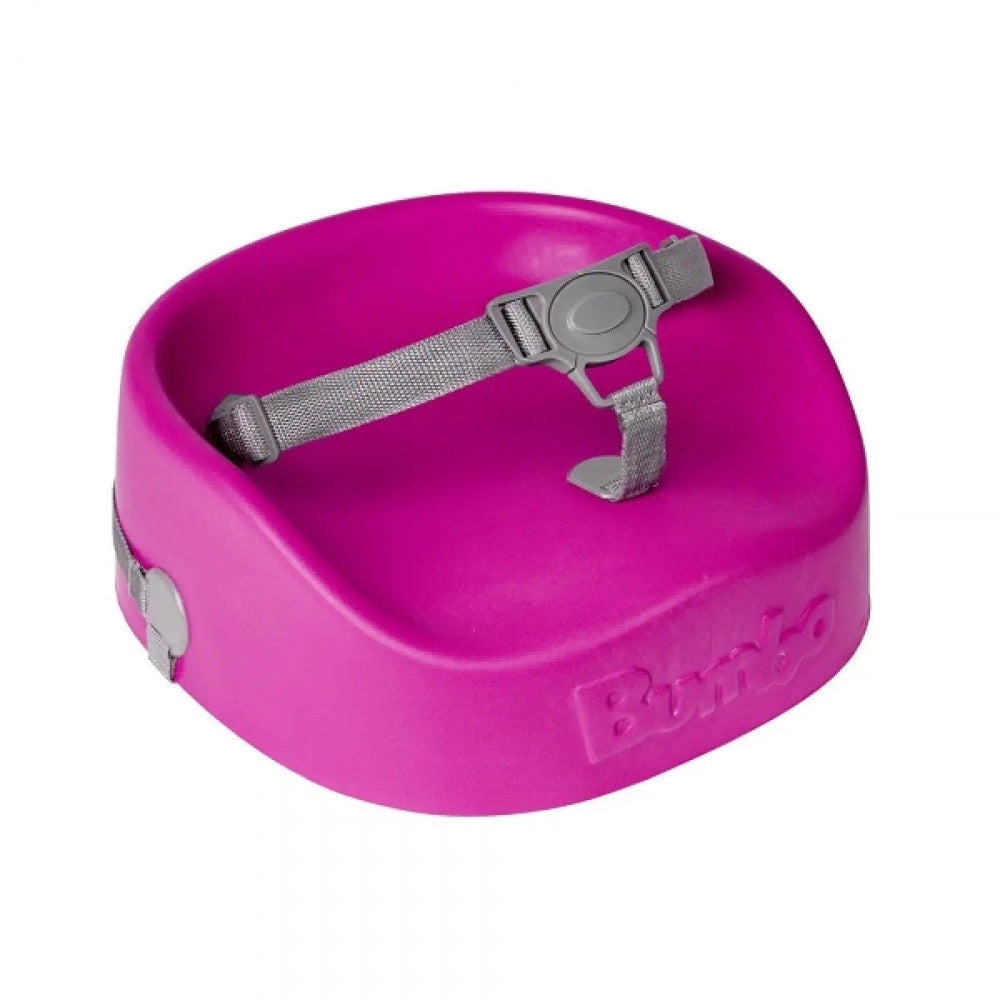Bumbo Booster Seat pink plastic booster with gray adjustable strap harness securing a child.