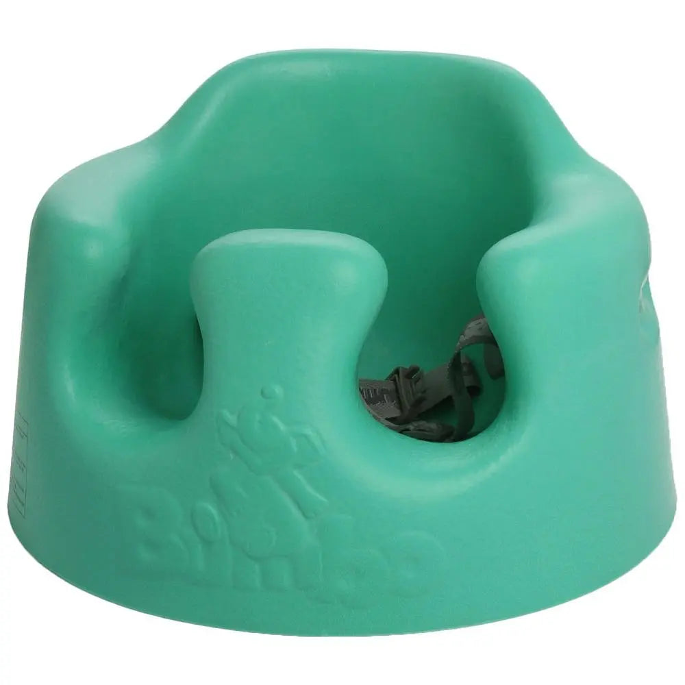 BUMBO Floor Seat in green with contoured back, a floor-ready baby booster chair on the floor.