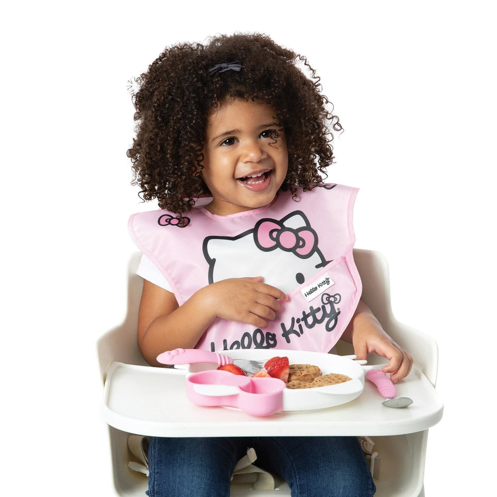 BUMKINS Disney Hello Kitty Super Bib 3-pack in pink; baby bibs worn by a smiling toddler at mealtime