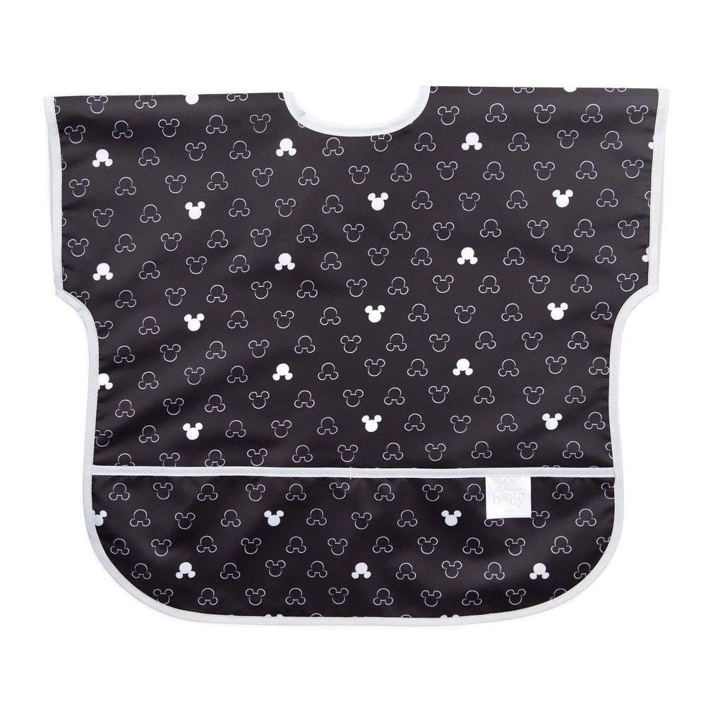 Bumkins Junior Bib Disney waterproof black bib with white Mickey heads, laid flat to show the material.