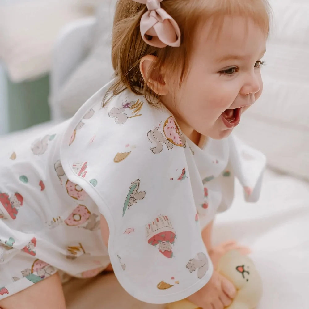 NEST DESIGNS Nest Designs Bamboo Burp 'n Bib 2 Pack Cheeky Capers long-sleeved top with all-over dessert and character print img 5/11