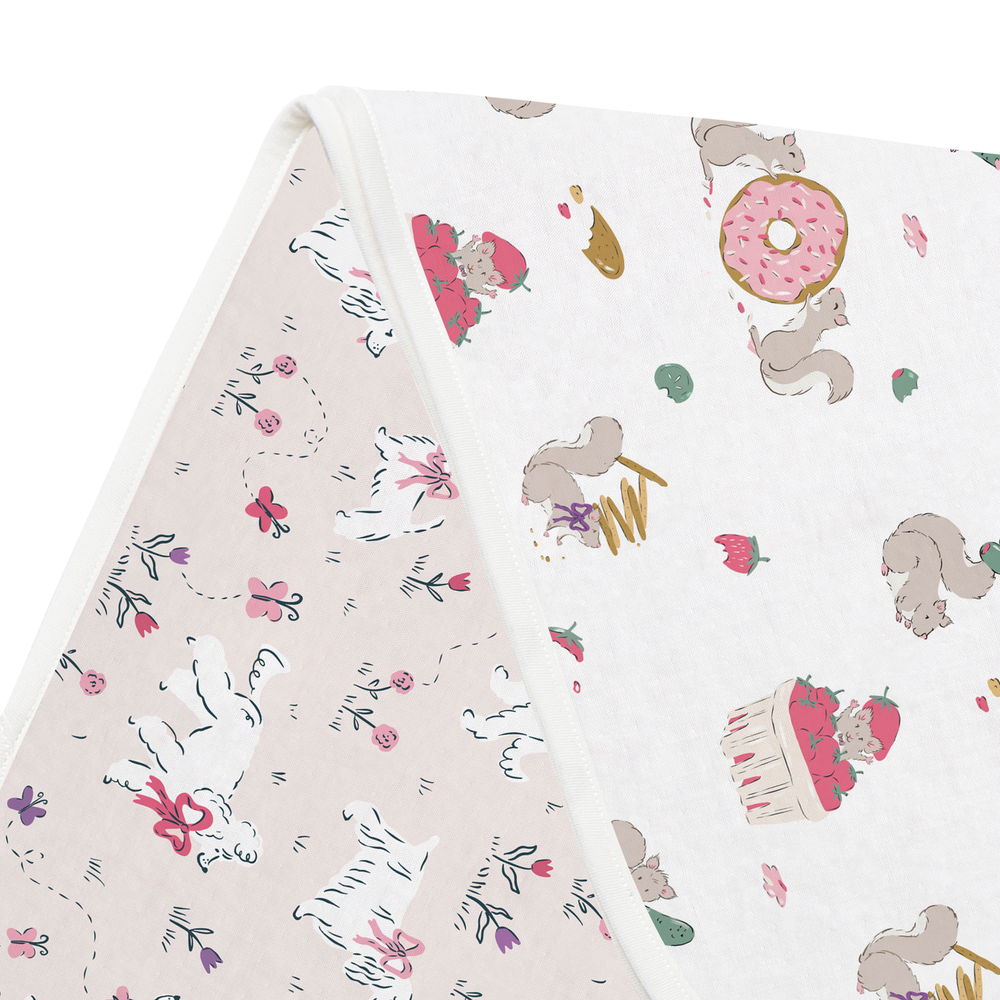 NEST DESIGNS Nest Designs Bamboo Burp 'n Bib 2 Pack Cheeky Capers Squirrels with donuts and strawberries print paired with floral img 11/11