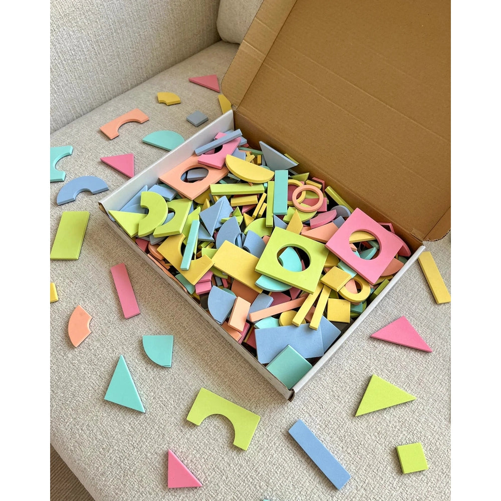 Cherrypick Magic Shape Set Soft Foam Magnetic Shapes in Pastel Multicolor in box on beige couch