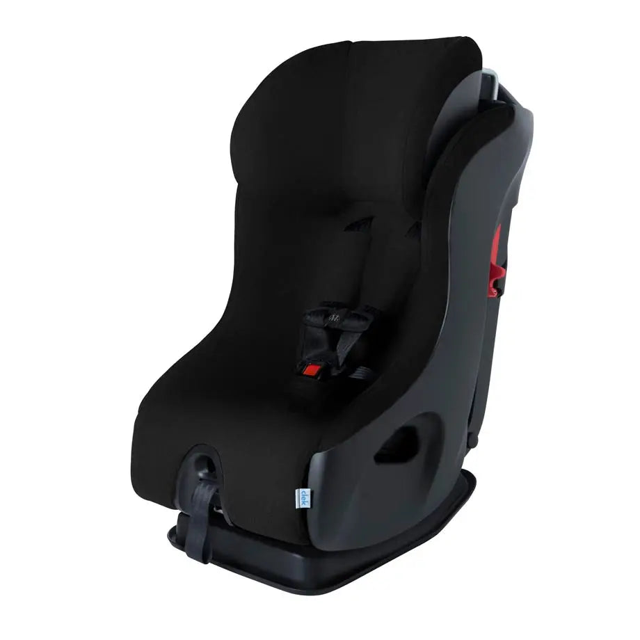 Clek Fllo convertible car seat in black fabric mounted on its base with a visible five-point harness.