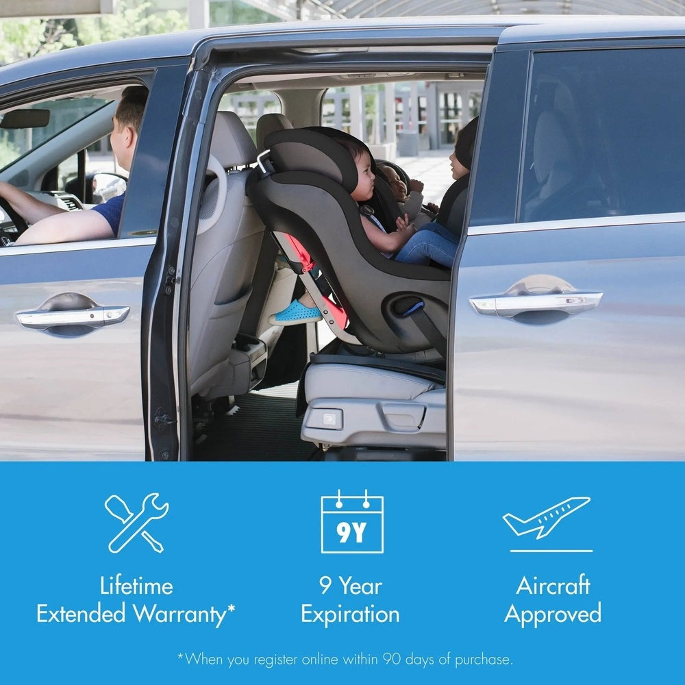 Clek Fllo convertible car seat in black/gray, securely installed in a minivan with a child buckled in.