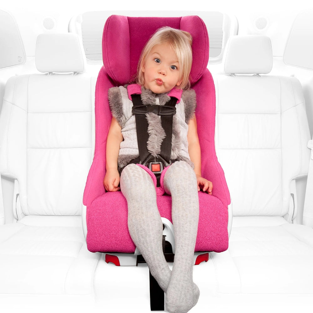 Clek Foonf convertible car seat in bright pink, child securely buckled into a five-point harness.
