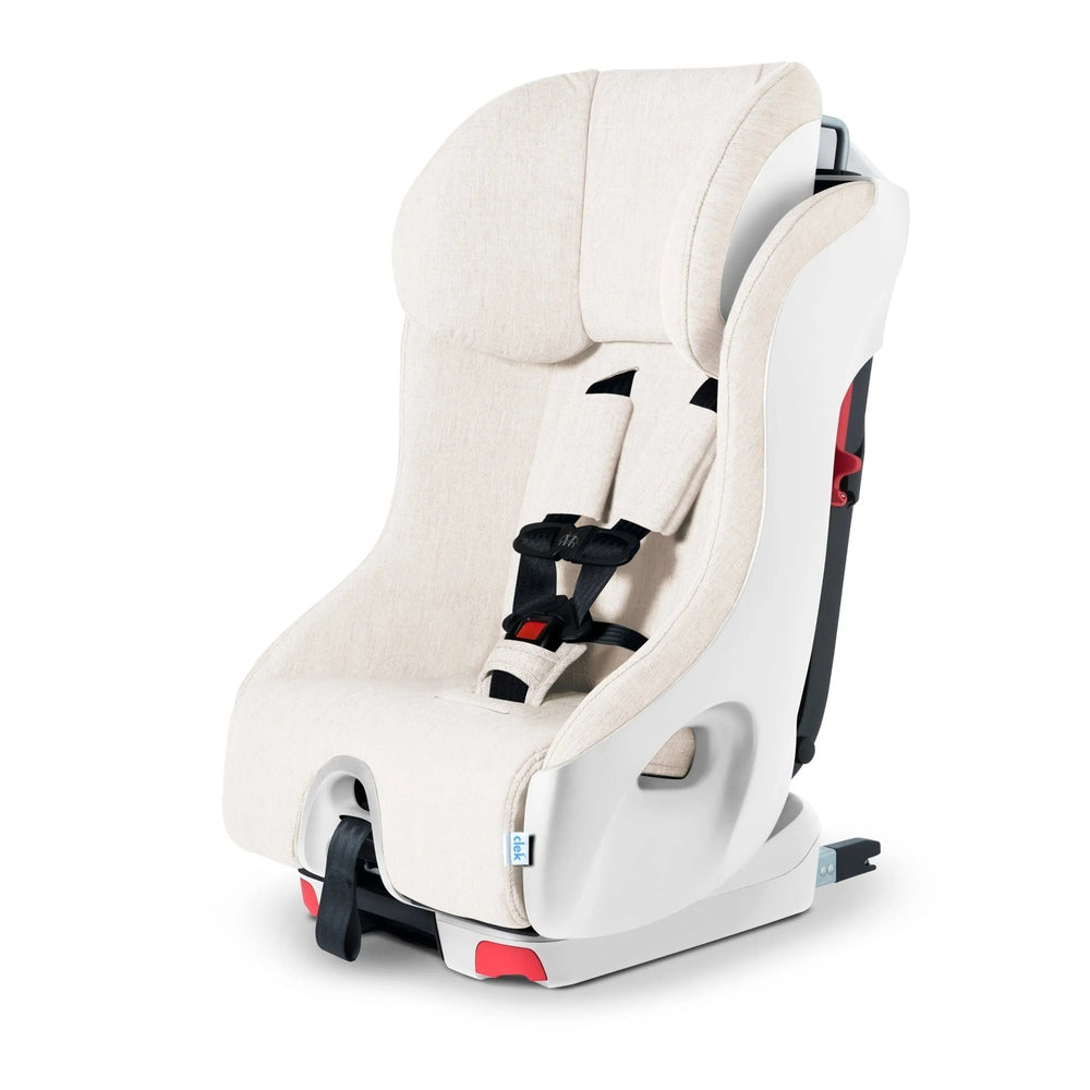 Clek Foonf convertible car seat in beige fabric with a 5-point harness and white base, CLEK.