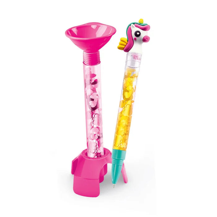 Clementoni Create Your Pens Fantasy unicorn pen set with pink stand; transparent bead-filled pens ready to write.
